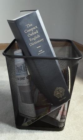 Dictionary in trash basket